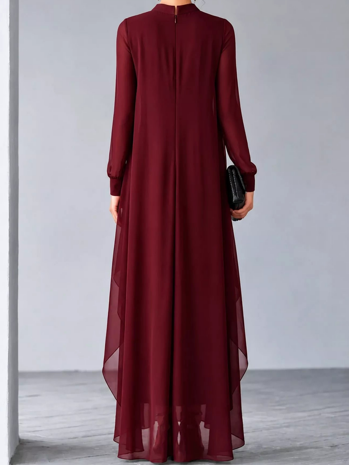 Back view of burgundy chiffon maxi dress with sheer sleeves and layered hem