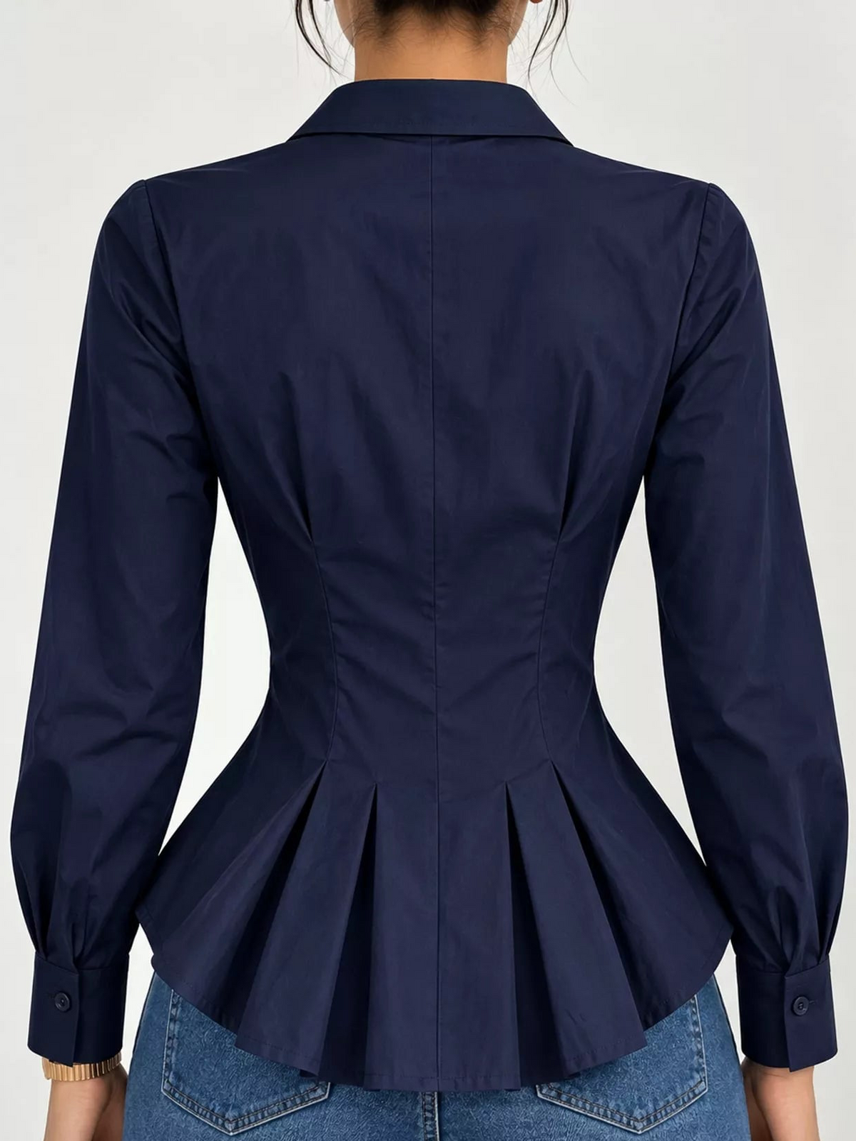 Navy button-down peplum blouse with fitted waist, long sleeves, back view
