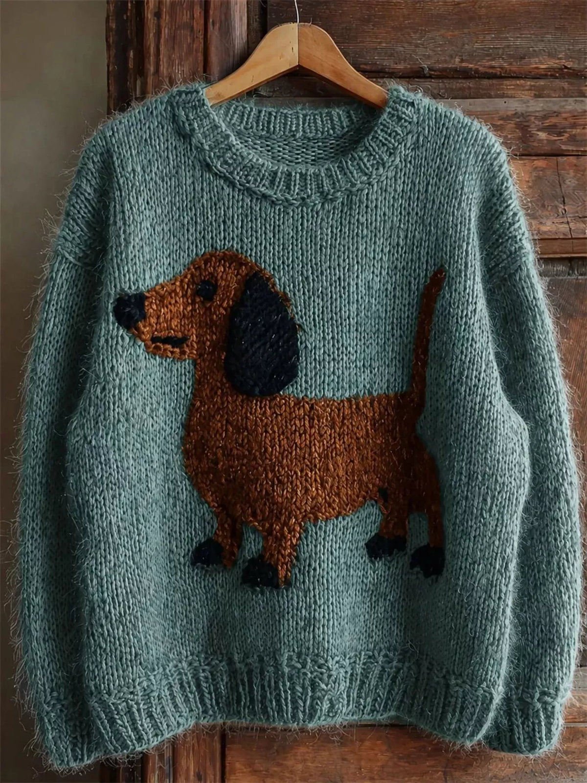 Teal dropped-shoulder knit sweater with dachshund intarsia front