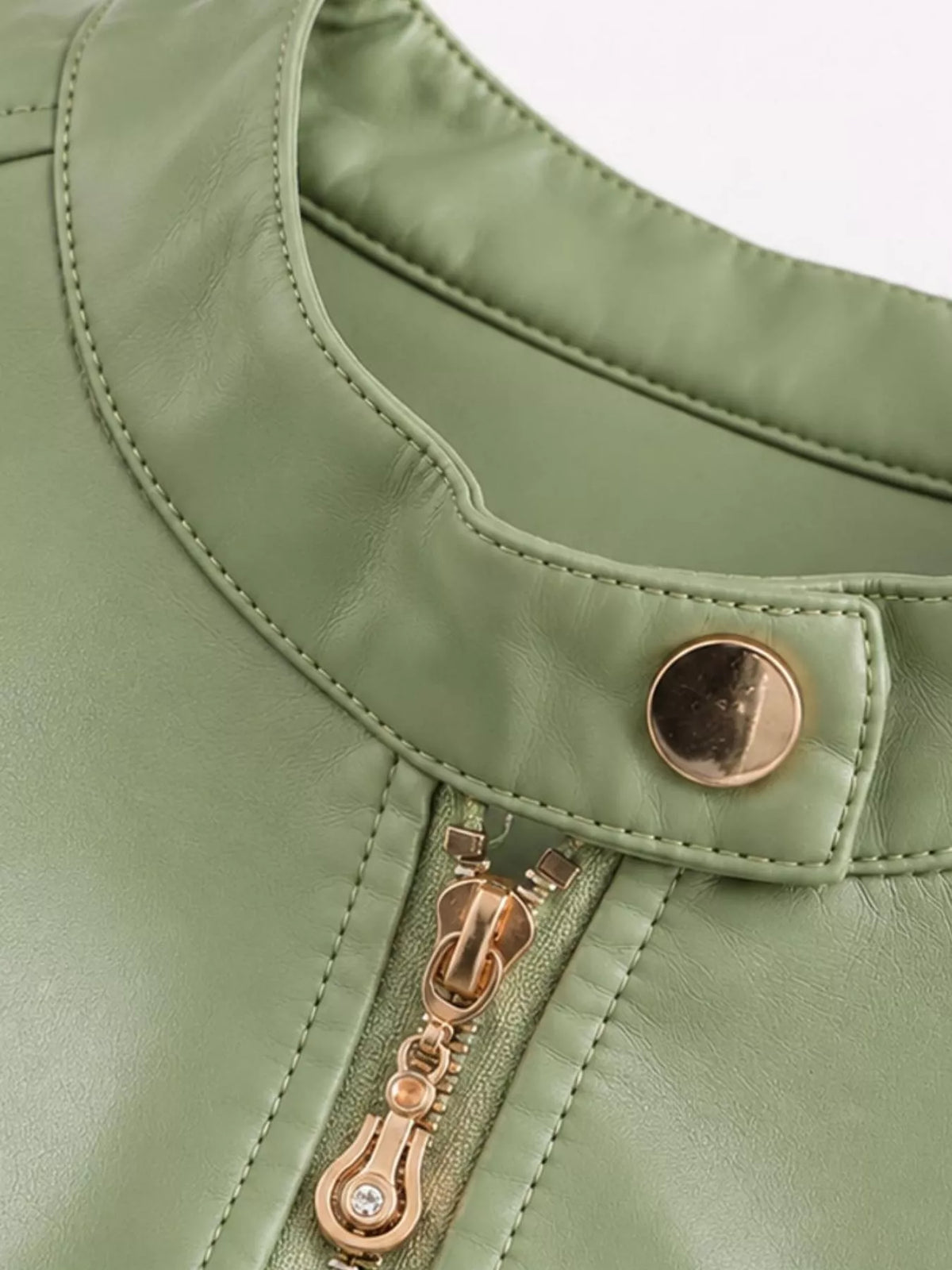 Light green moto jacket collar snap and exposed zipper detail