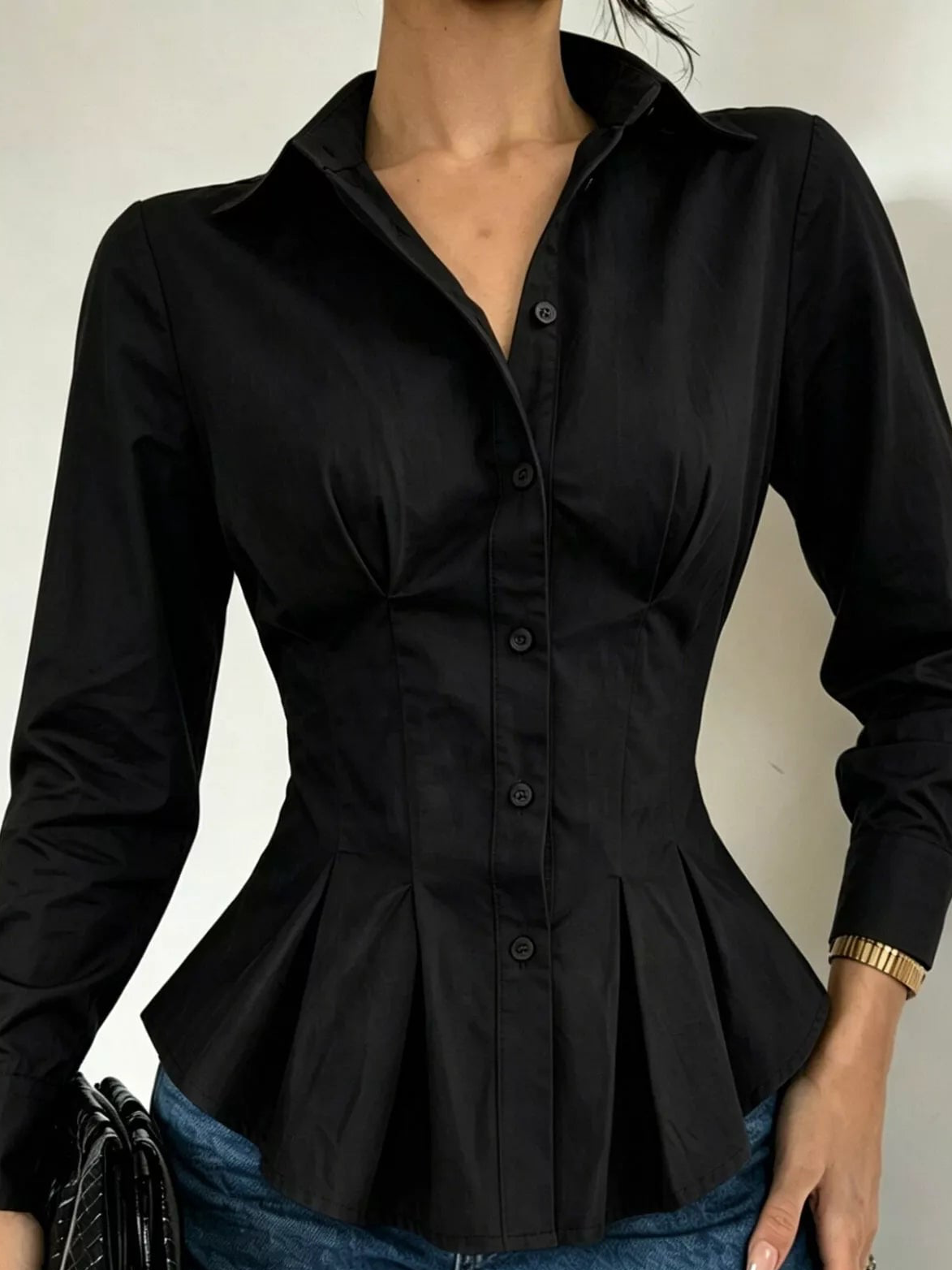 Black button-down peplum blouse with fitted waist, long sleeves, front view