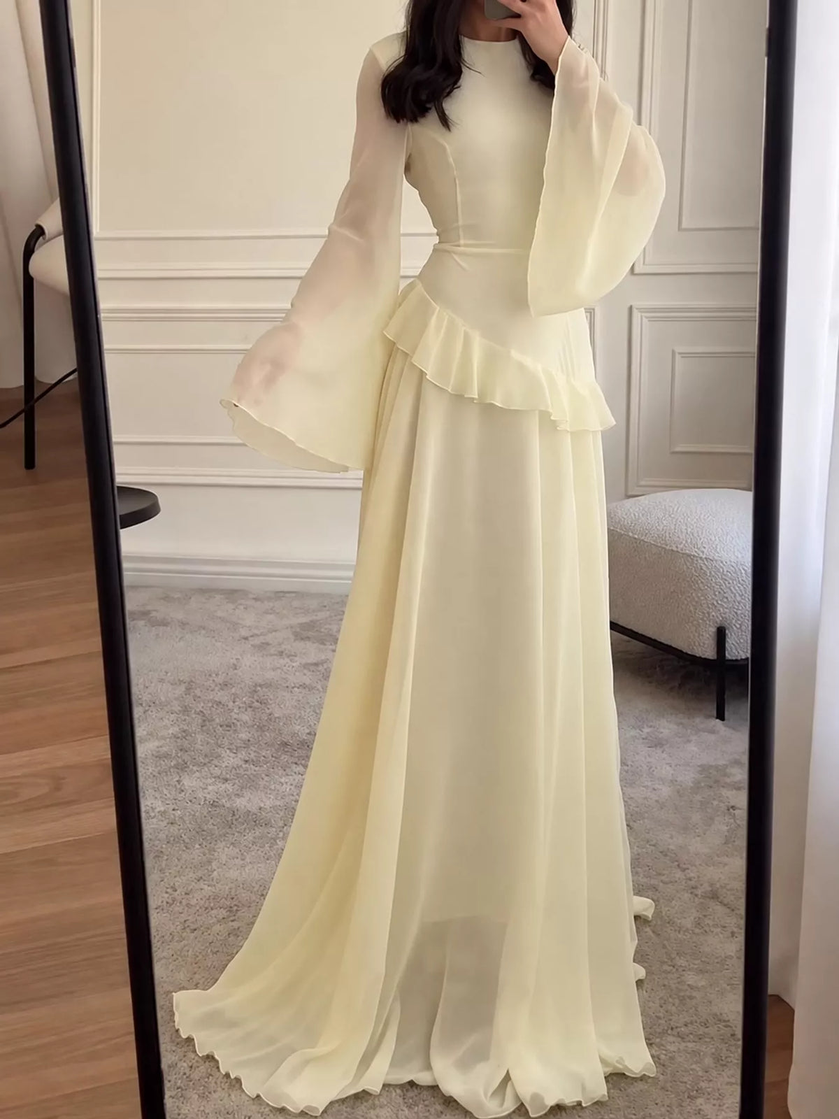 Light yellow plus-size maxi dress with tiered ruffle bodice and long flared sleeves