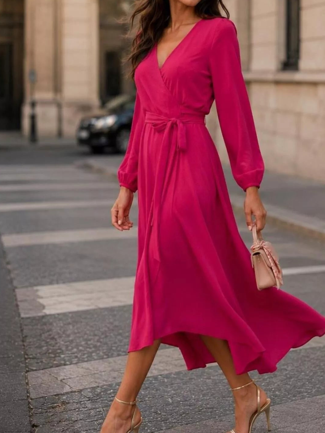 Scarlet long-sleeve wrap dress with V-neck and waist tie, flowing midi skirt.