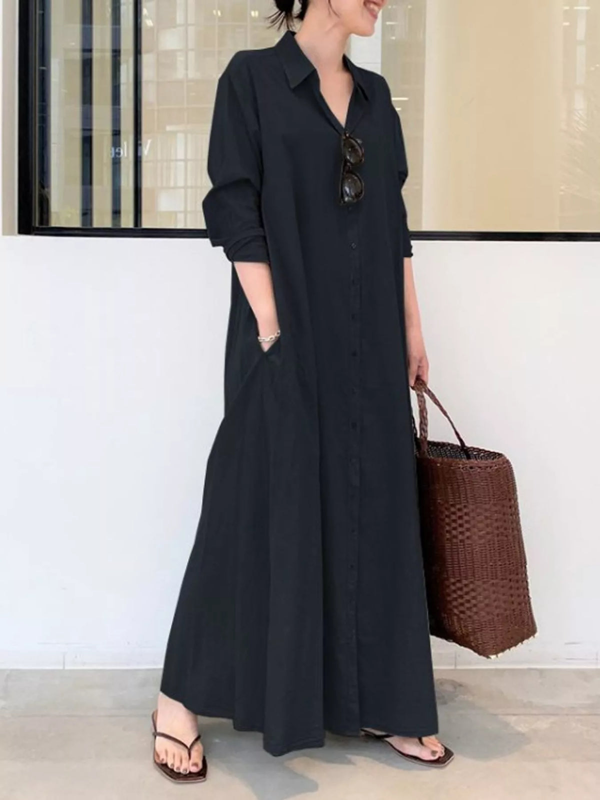 Black button-front long-sleeve maxi shirt dress with pointed collar and 3/4 sleeve cuffs