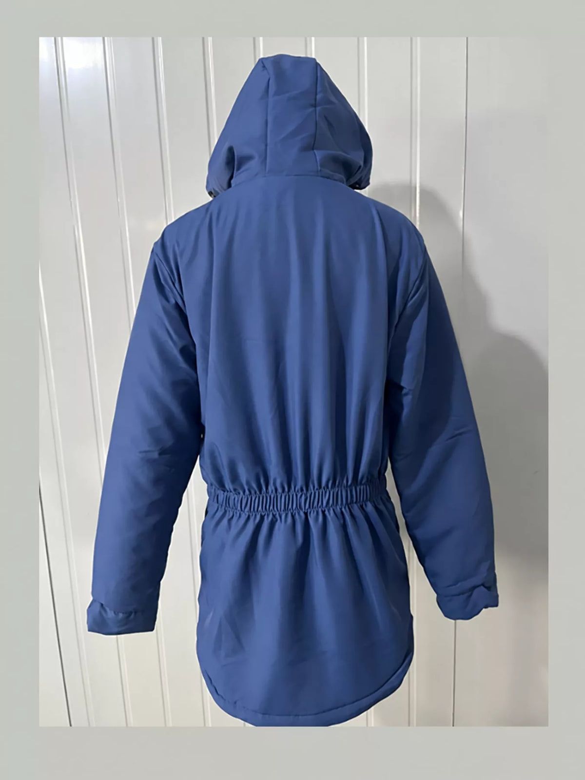 Blue sherpa-lined hooded parka with back gather detail and drawstring hood