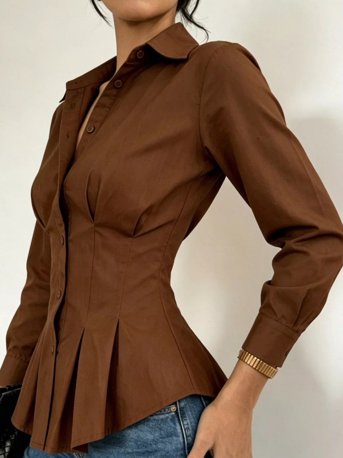 Dark brown button-down peplum blouse, long sleeves, front button placket, peplum detail