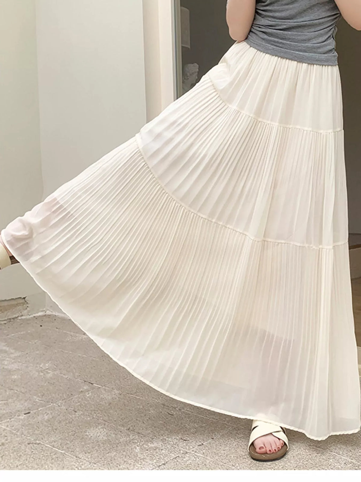 White tiered pleated maxi skirt with high elastic waistband