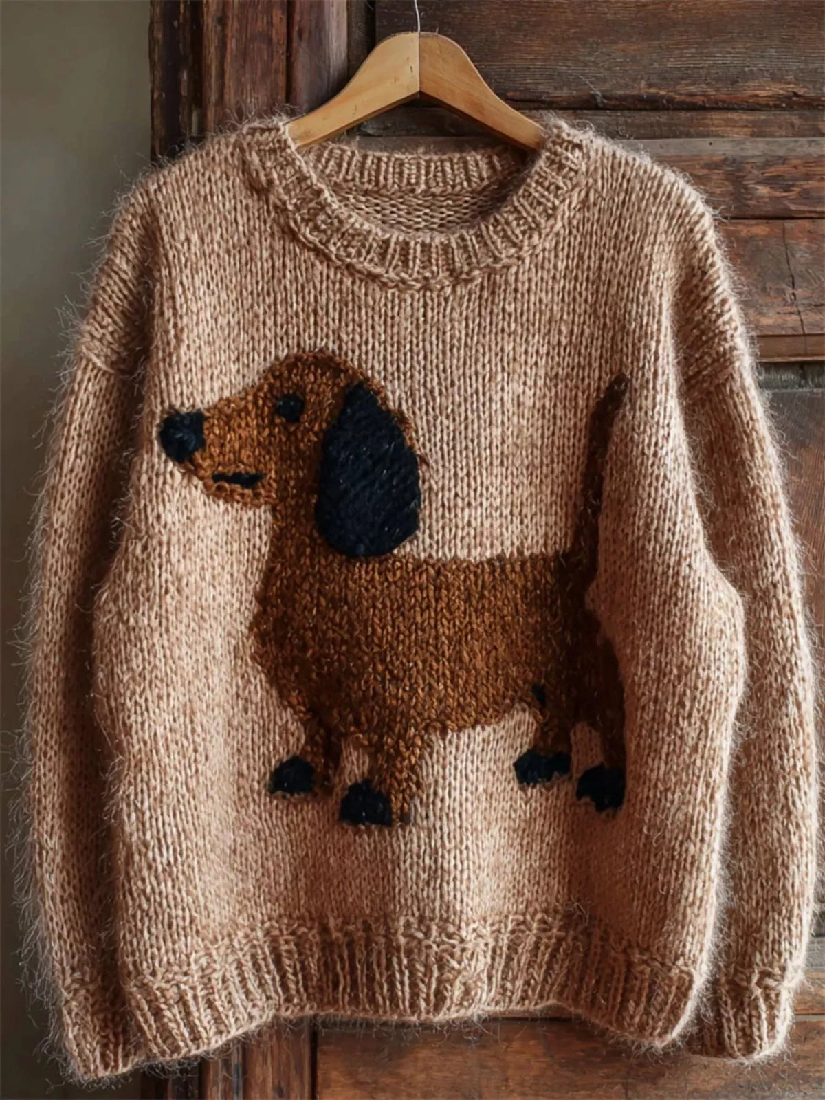 Tan dropped-shoulder knit sweater with dachshund intarsia front