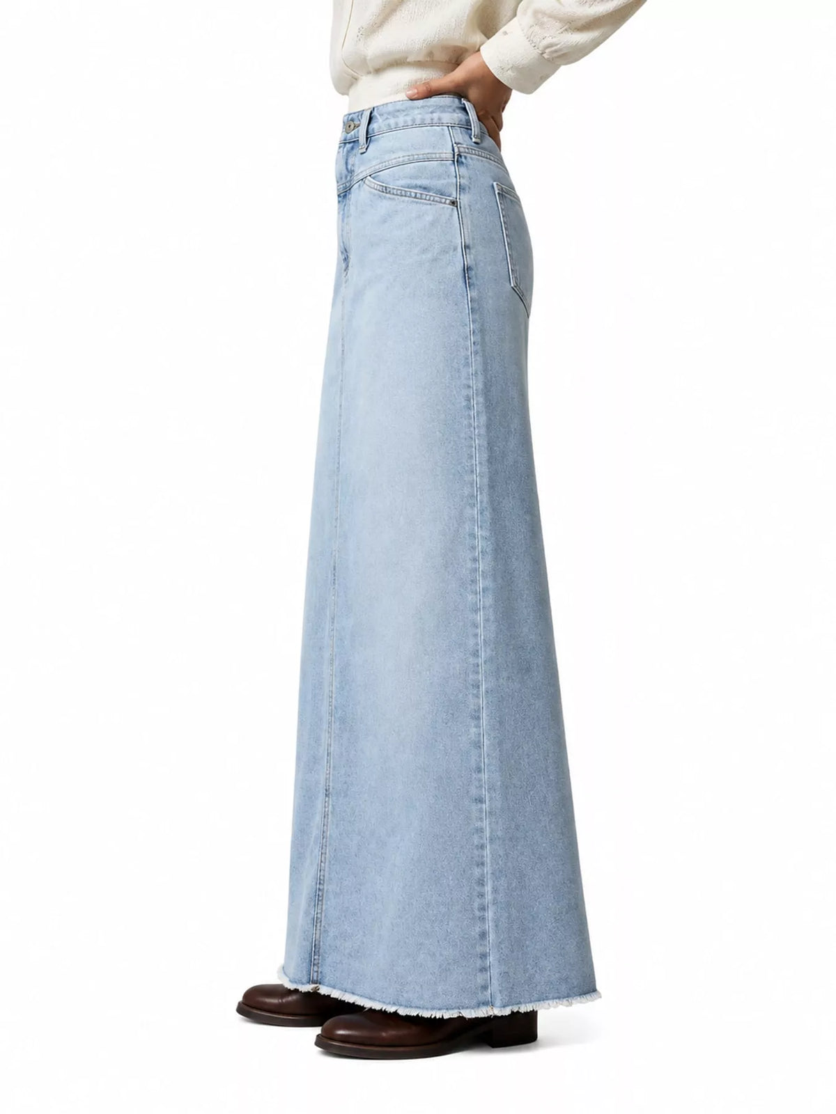 Light blue denim maxi skirt with raw hem and vertical front seams
