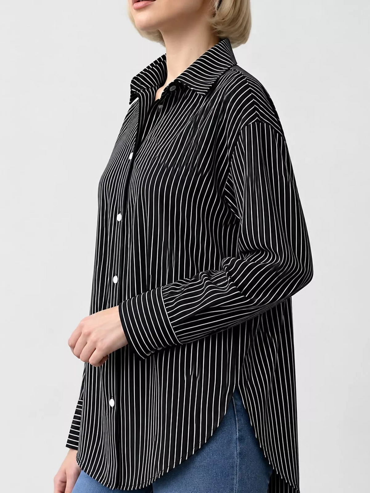 Black and white striped long-sleeve button-up shirt, side view with curved hem