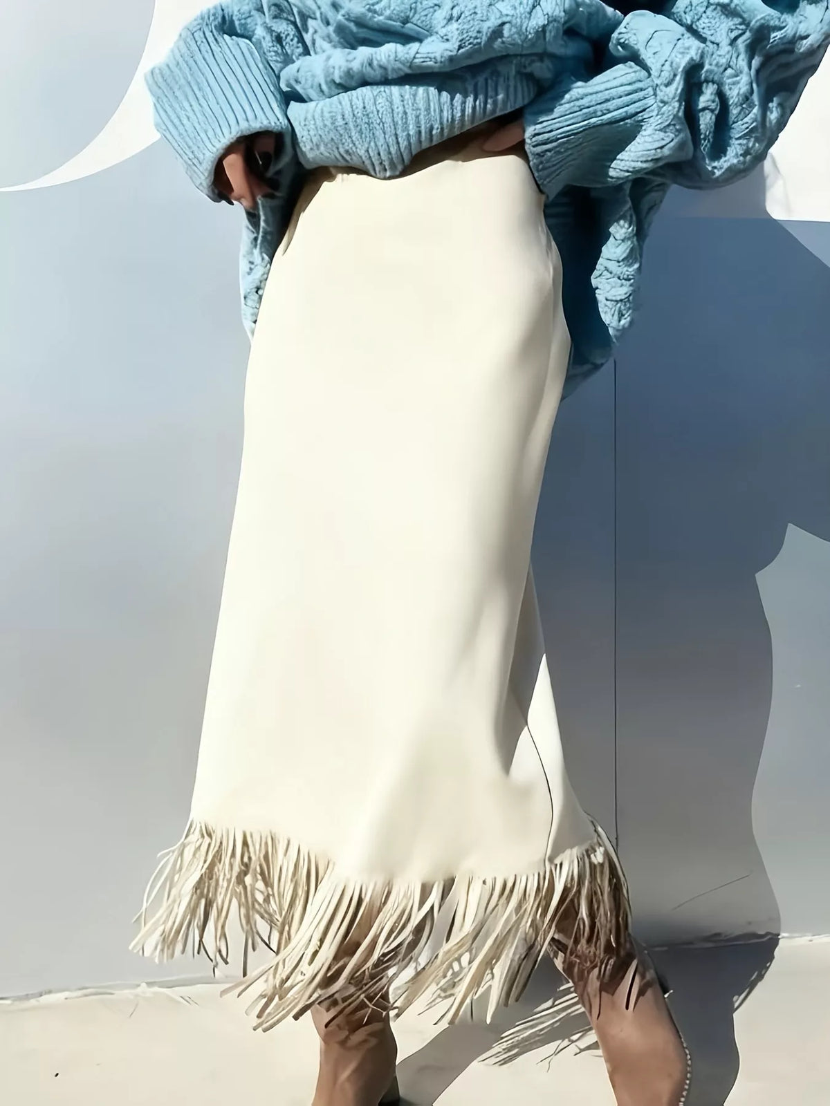 Off-white suede midi skirt with high waist and long fringe hem