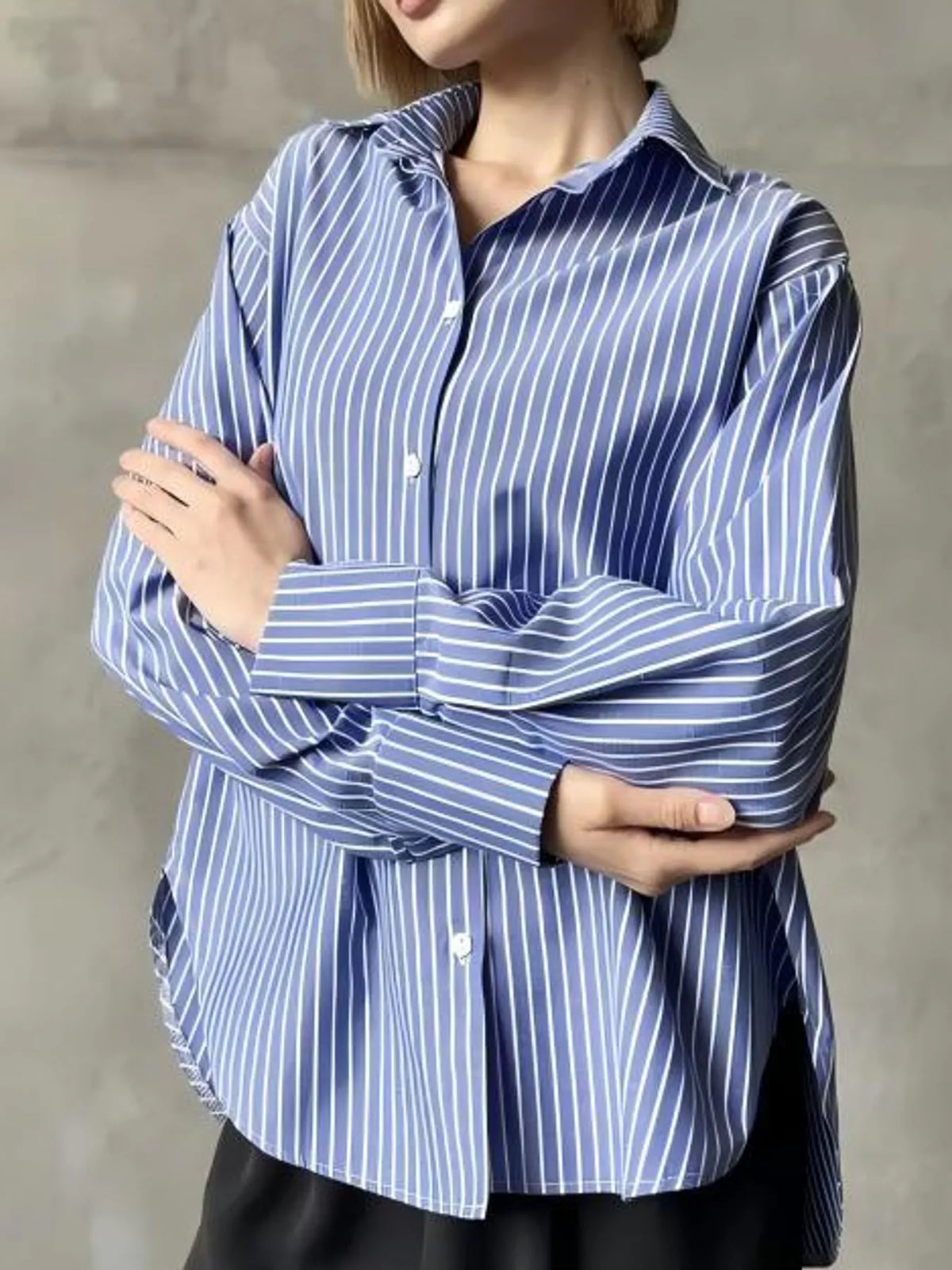 Blue striped button-up long sleeve shirt with pointed collar and front buttons