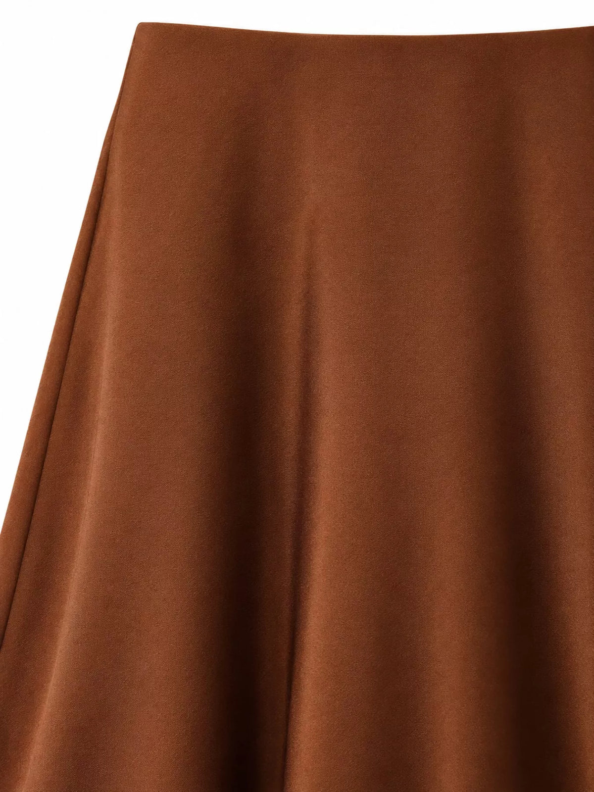 Close-up of the caramel satin midi skirt's smooth fabric and high waist