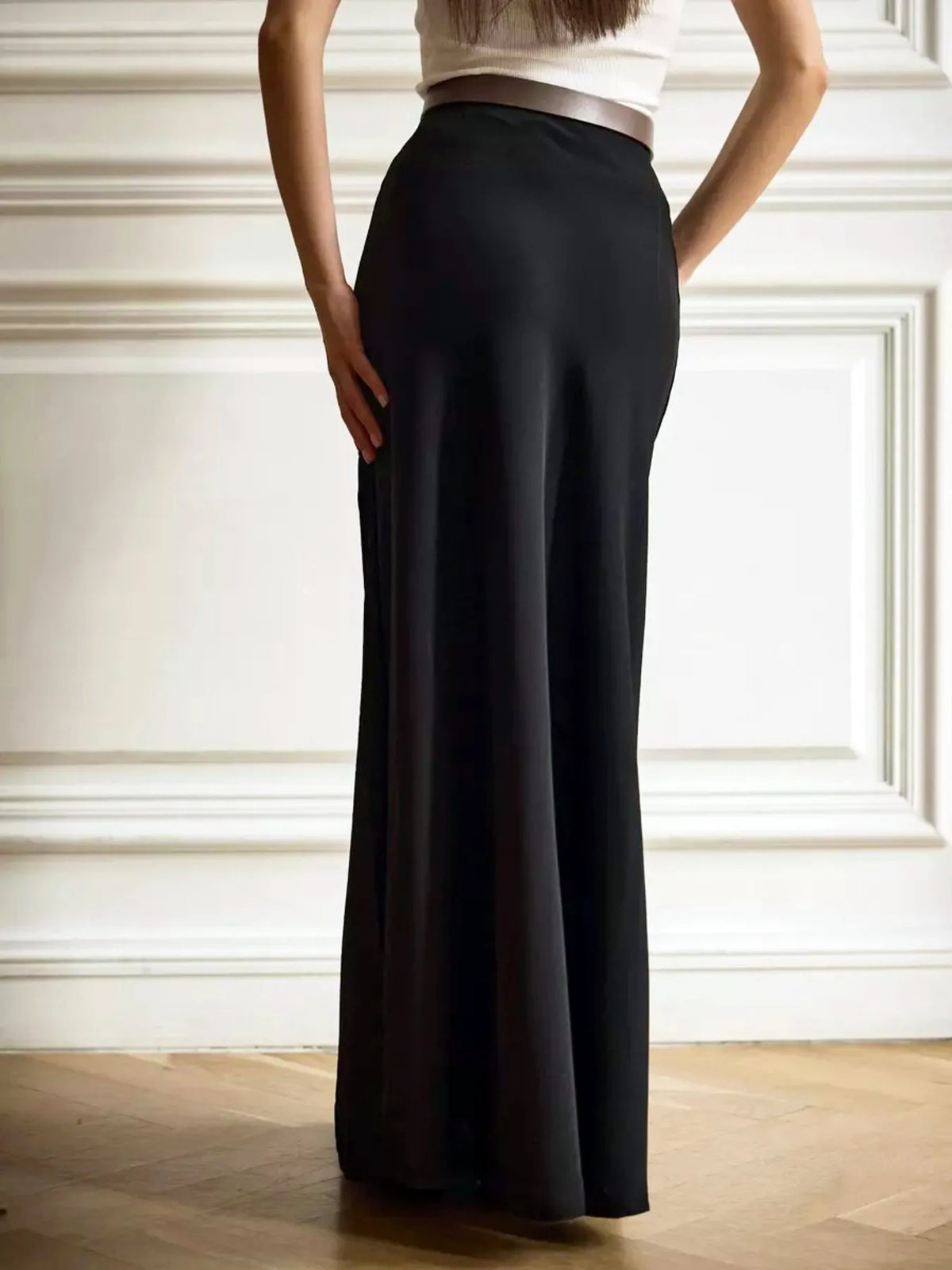 Black high-waisted maxi skirt with tailored waist and column-like fall