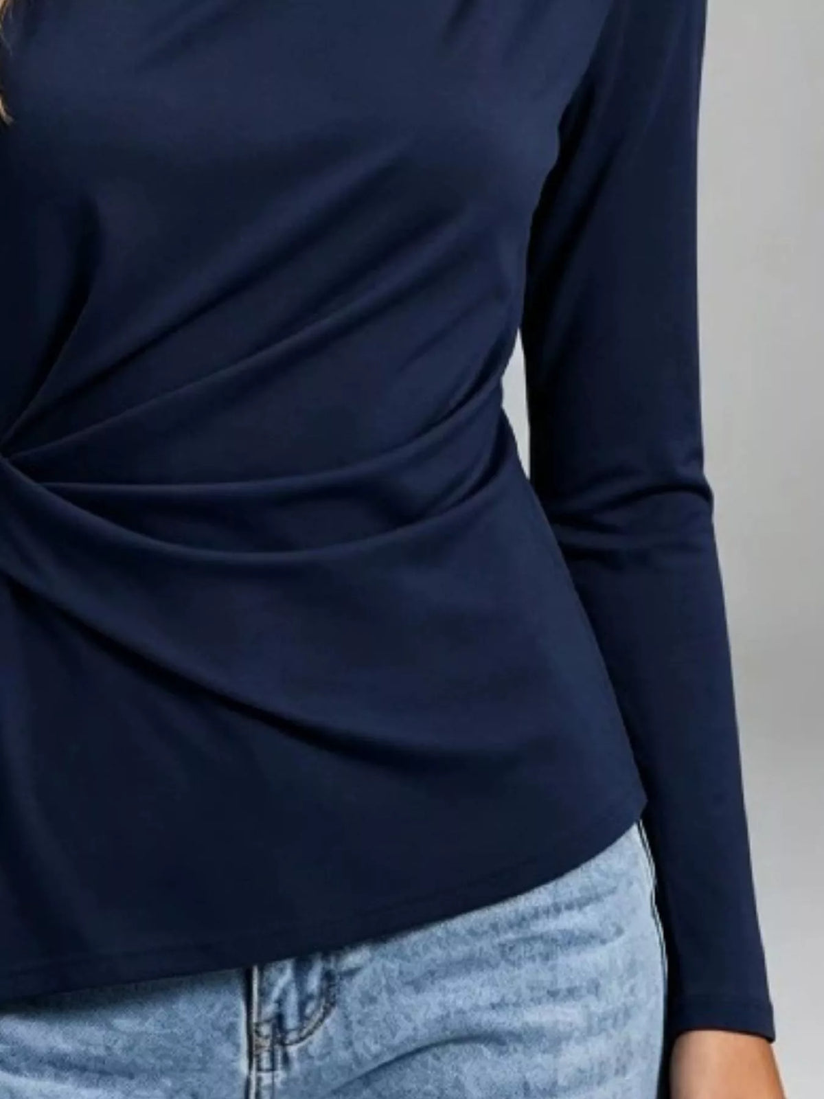 Navy ruched-waist long-sleeve t-shirt close-up of gathered front drape
