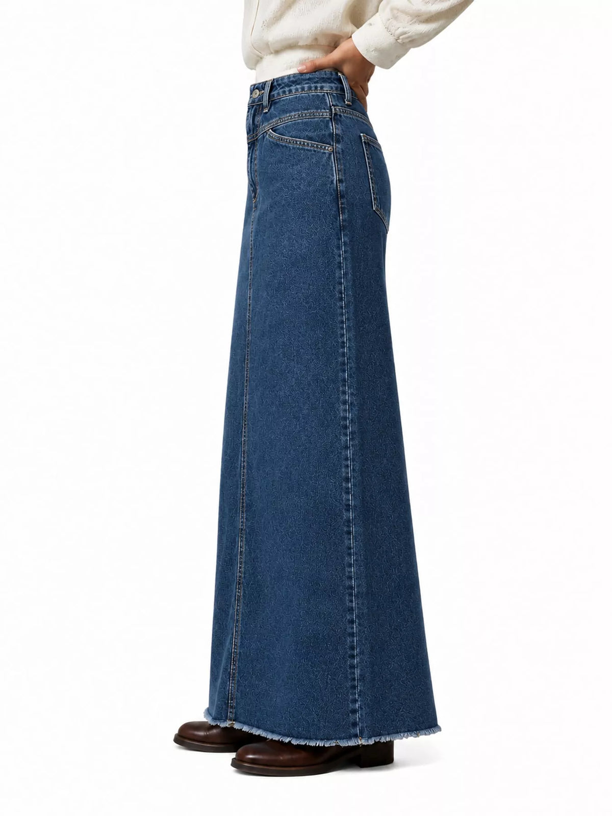 Dark blue raw-hem maxi denim skirt with button closure and front seam stitching