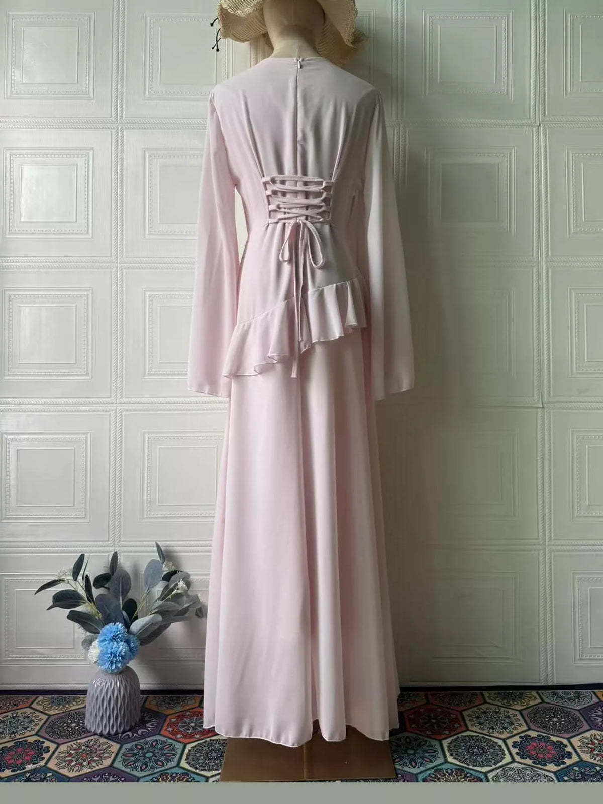 Light pink maxi dress with lace-up back detail and layered ruffle skirt