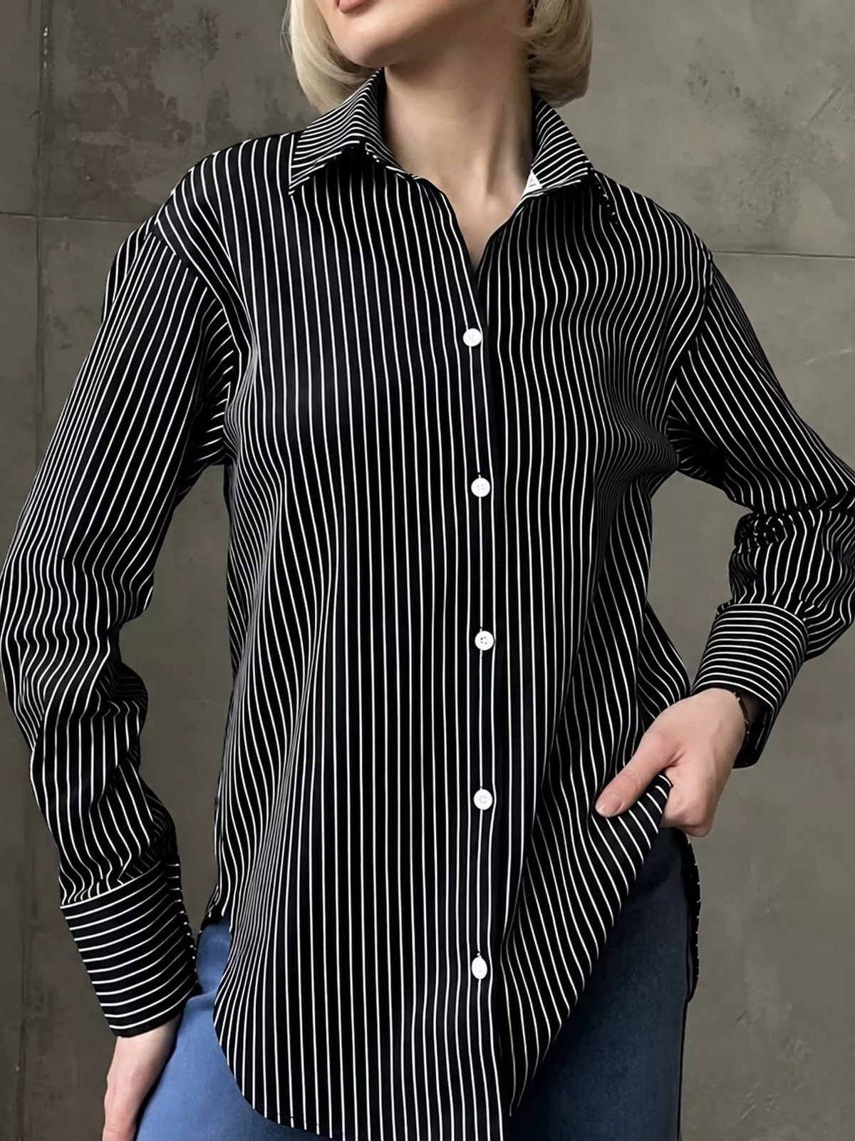 Black and white striped long-sleeve button-up shirt with pointed collar