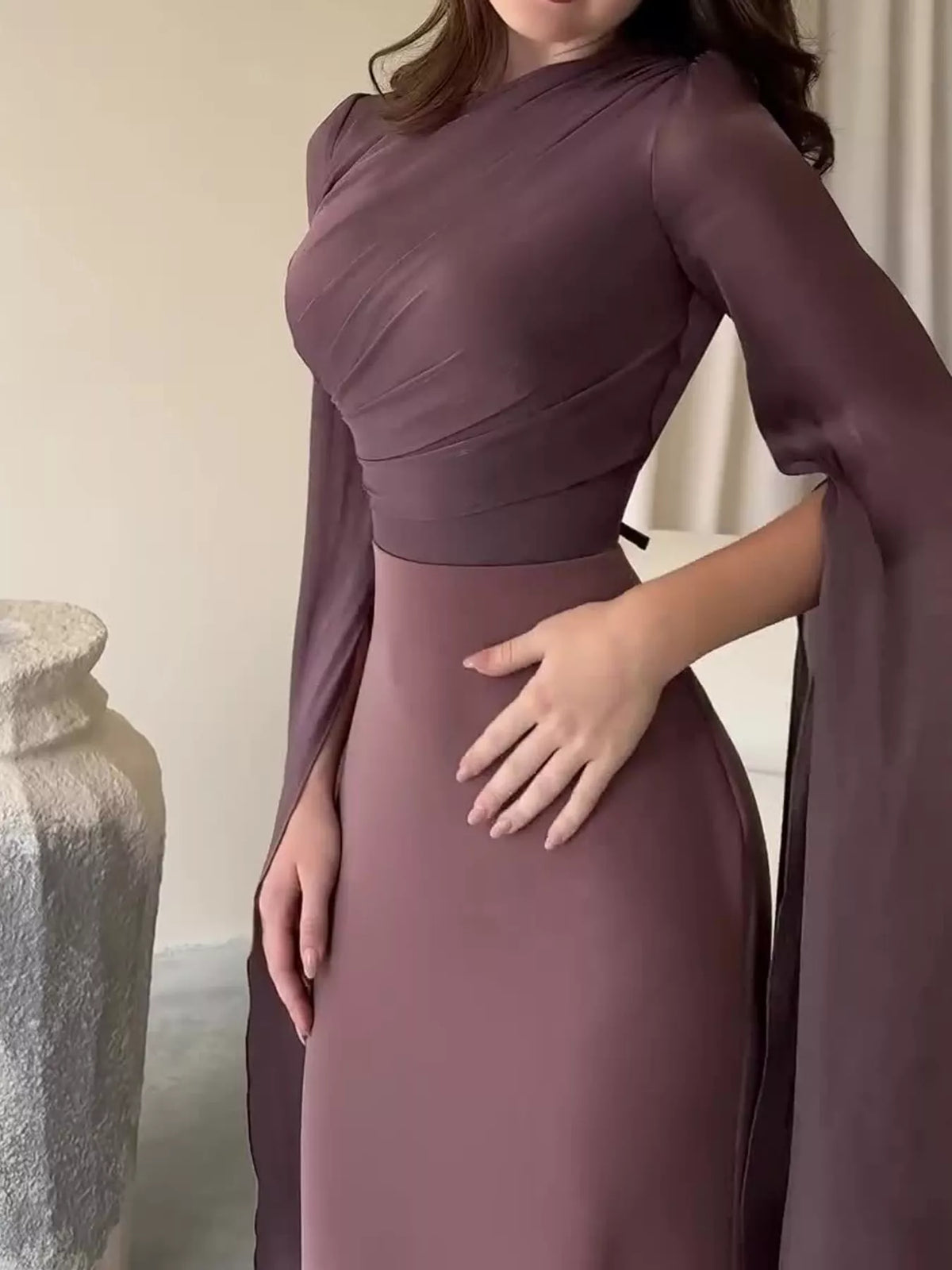 Mauve maxi dress with a wrapped bodice and long flared sleeves