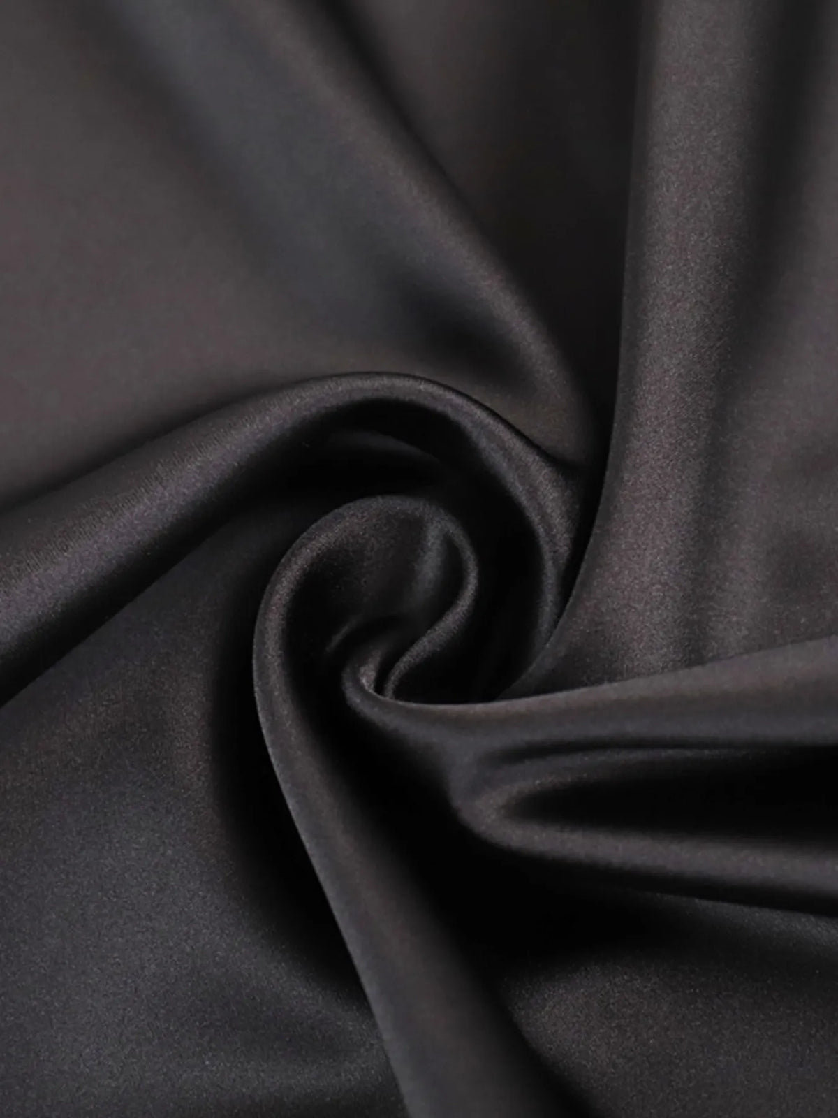 Black high-waisted maxi skirt fabric close-up with smooth drape and soft sheen.