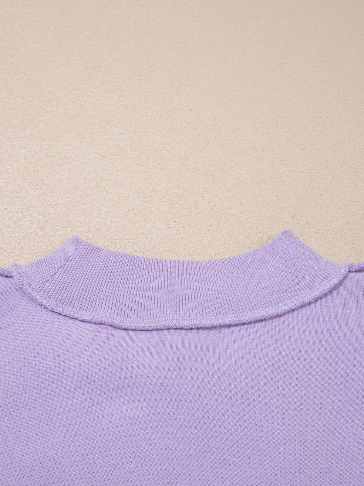 Lavender mock neck ribbed collar and neckline seam