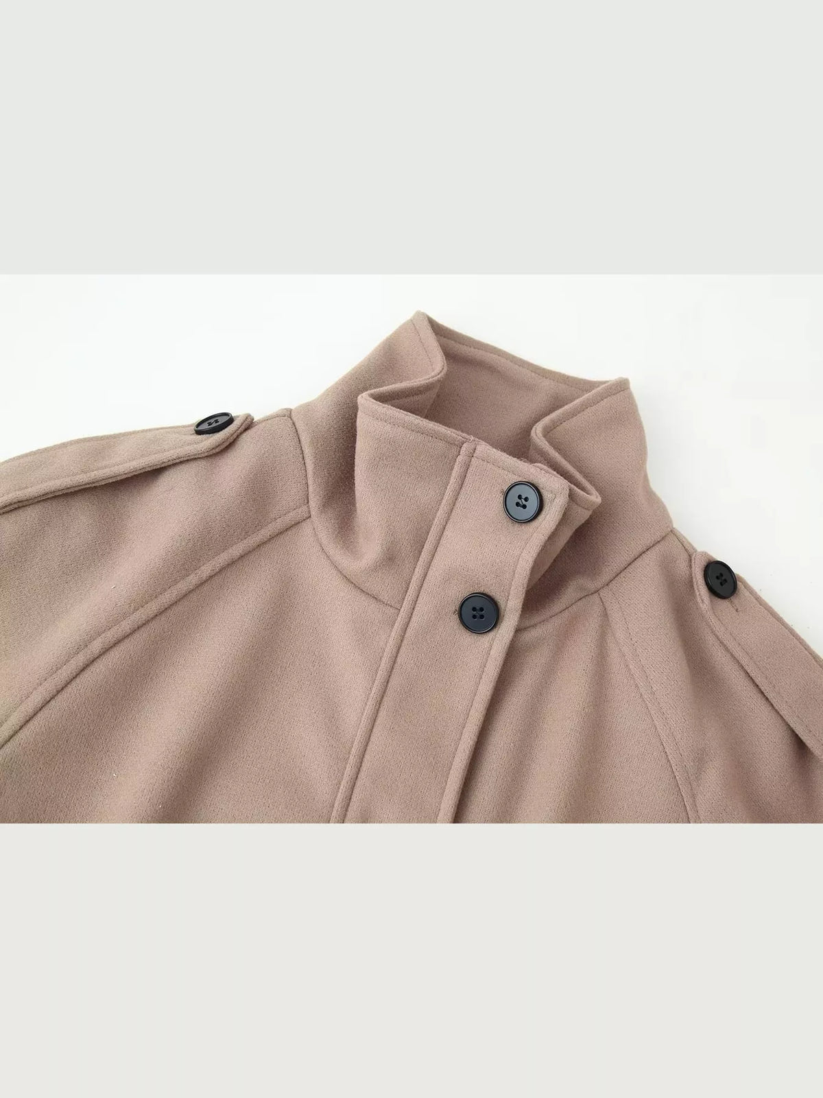 Taupe stand-collar jacket close-up with button placket and zipper front