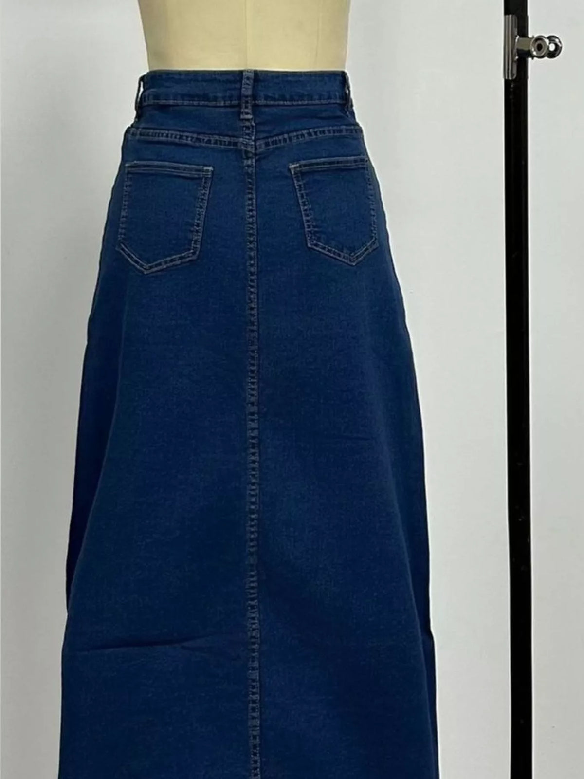 Dark blue maxi denim skirt with button fly and front patch pockets