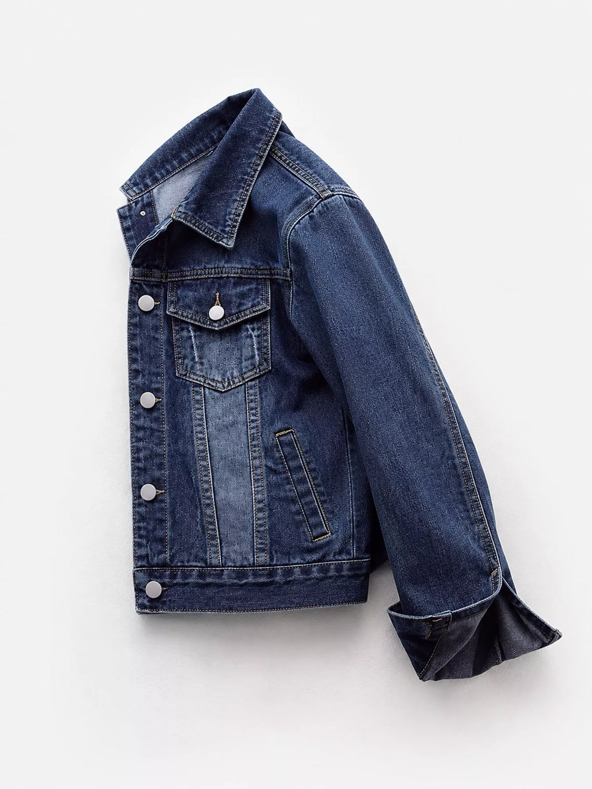 Dark wash denim button-front jacket with flap chest pockets, side view