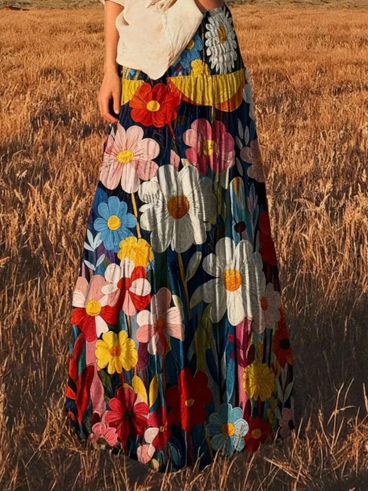 High-waisted maxi skirt with mixed red, pink, yellow, and white flowers on dark fabric