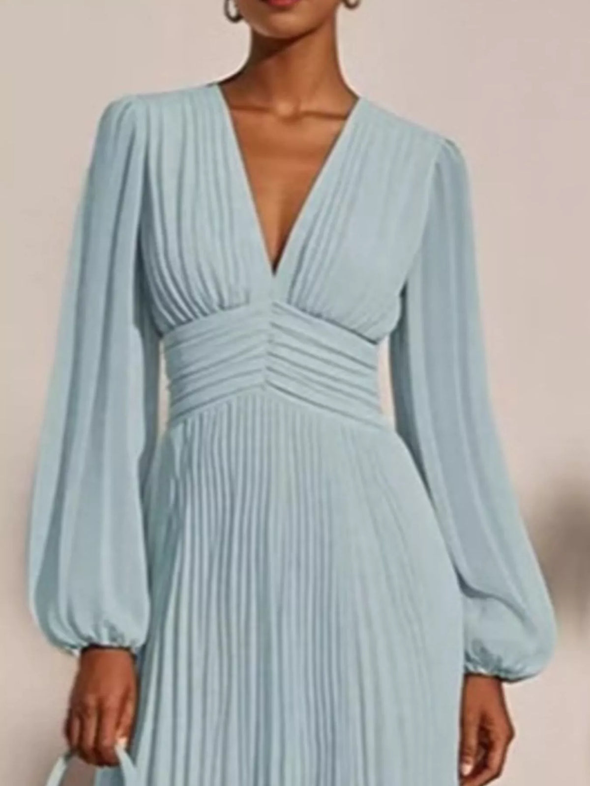 Turquoise pleated chiffon midi dress with a deep V-neck and long puff sleeves