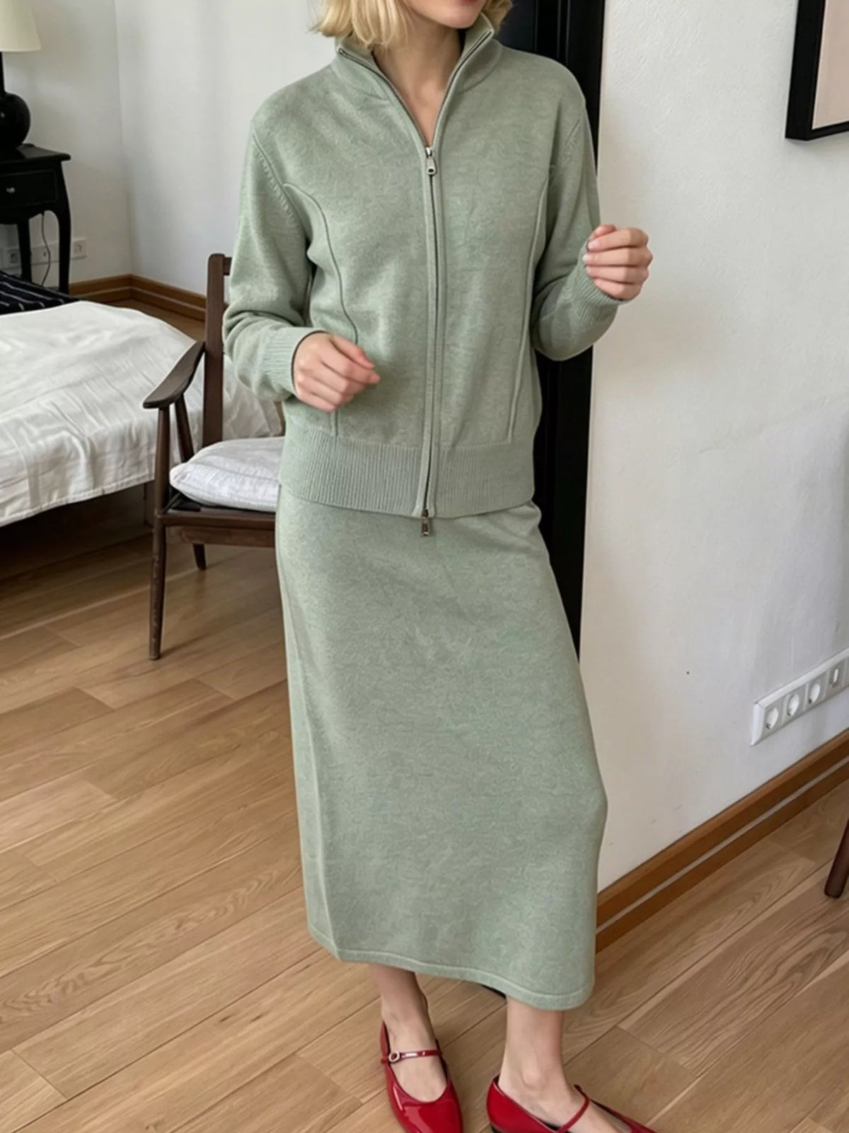 Sage knit cardigan and midi skirt set, shown with the cardigan zipped up
