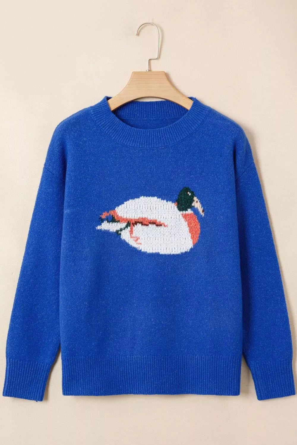 Royal blue knit sweater with duck graphic on front, crew neck, long sleeves