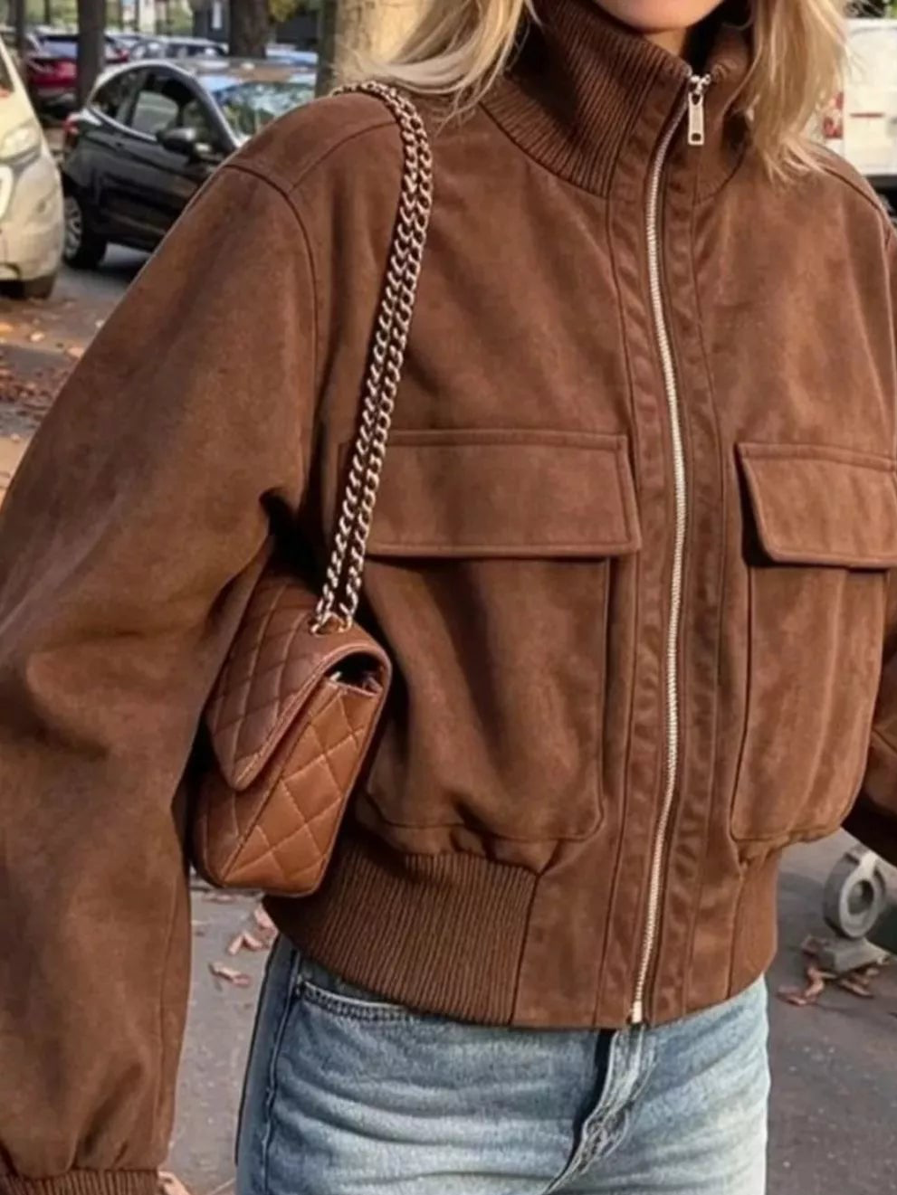 Caramel brown zip-up jacket with ribbed mock neck, front zipper, and chest pocket flaps