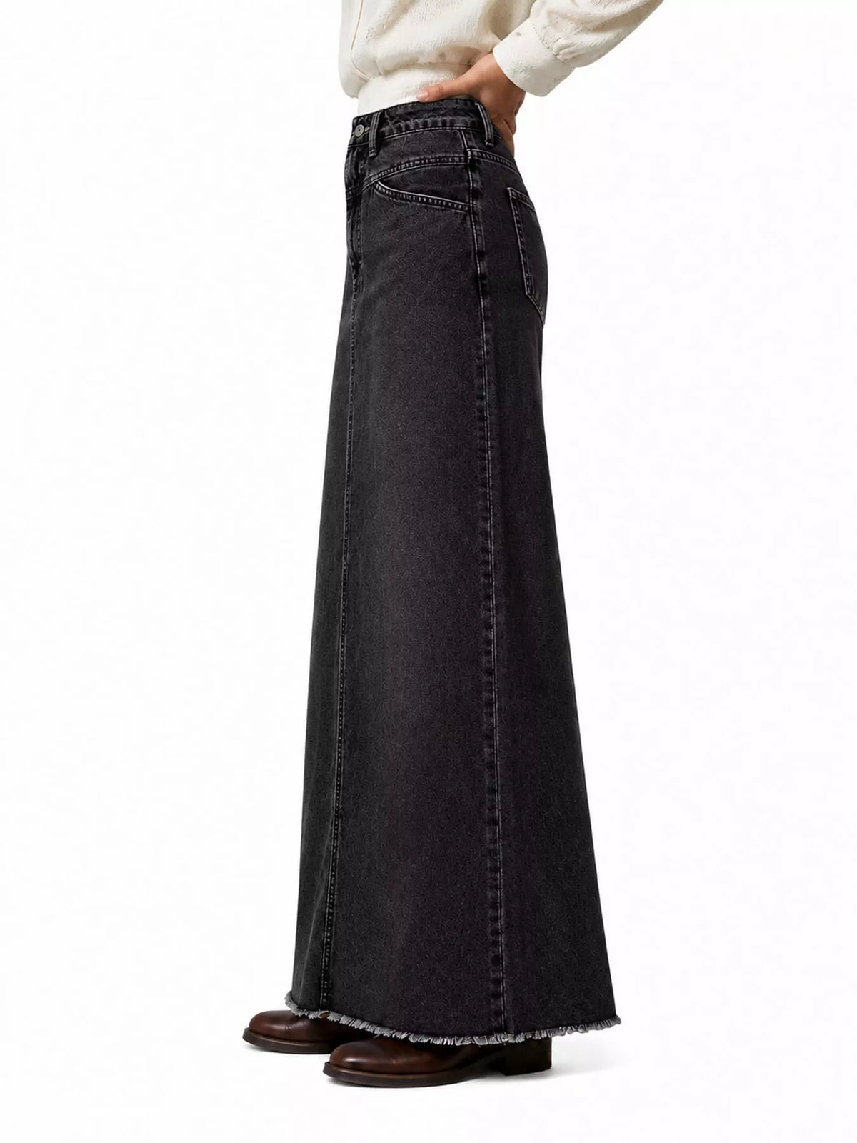 Black denim maxi skirt with raw hem and vertical stitched front panel