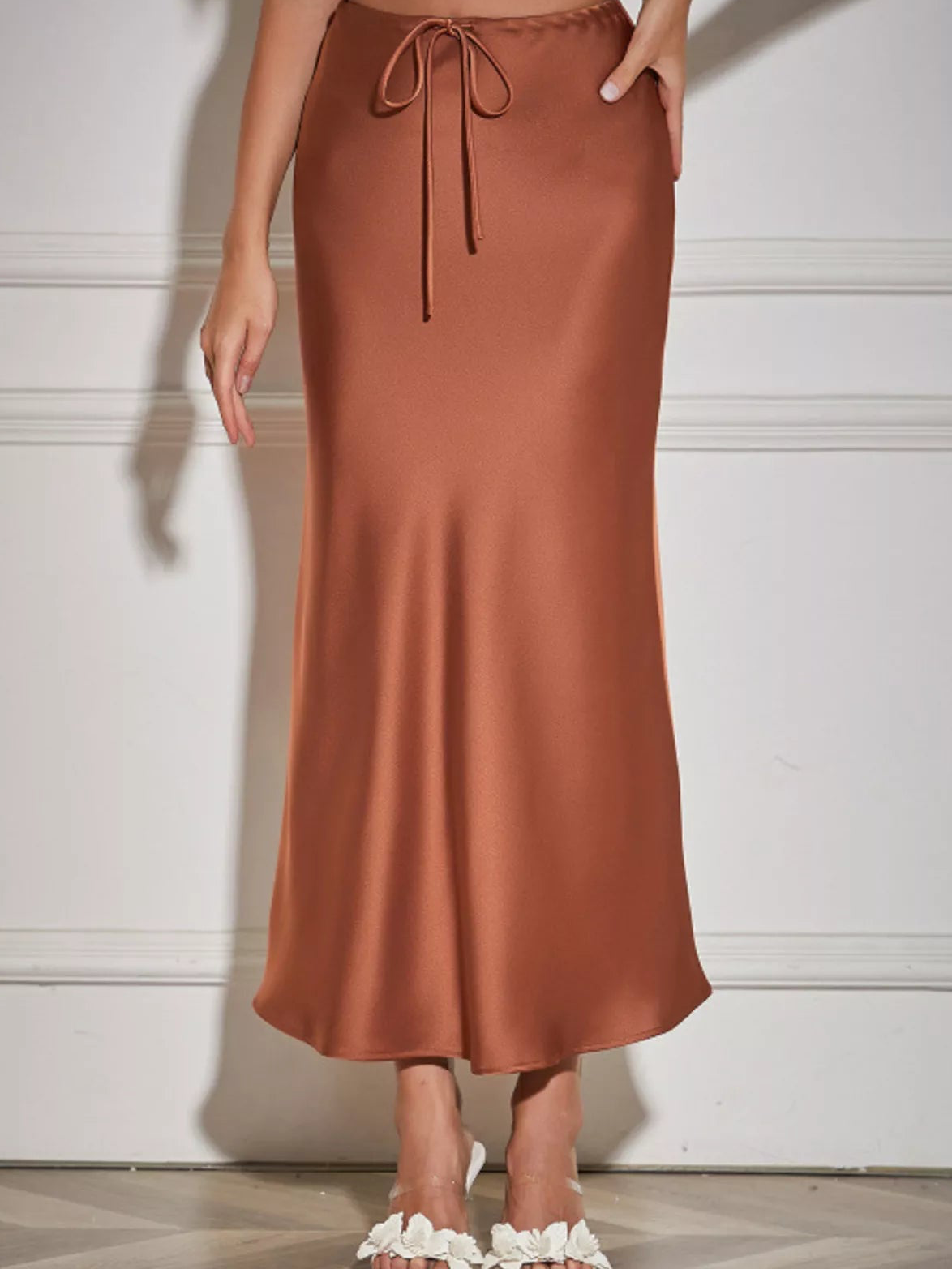 Brown satin midi skirt with a drawstring waist and gently flared hem