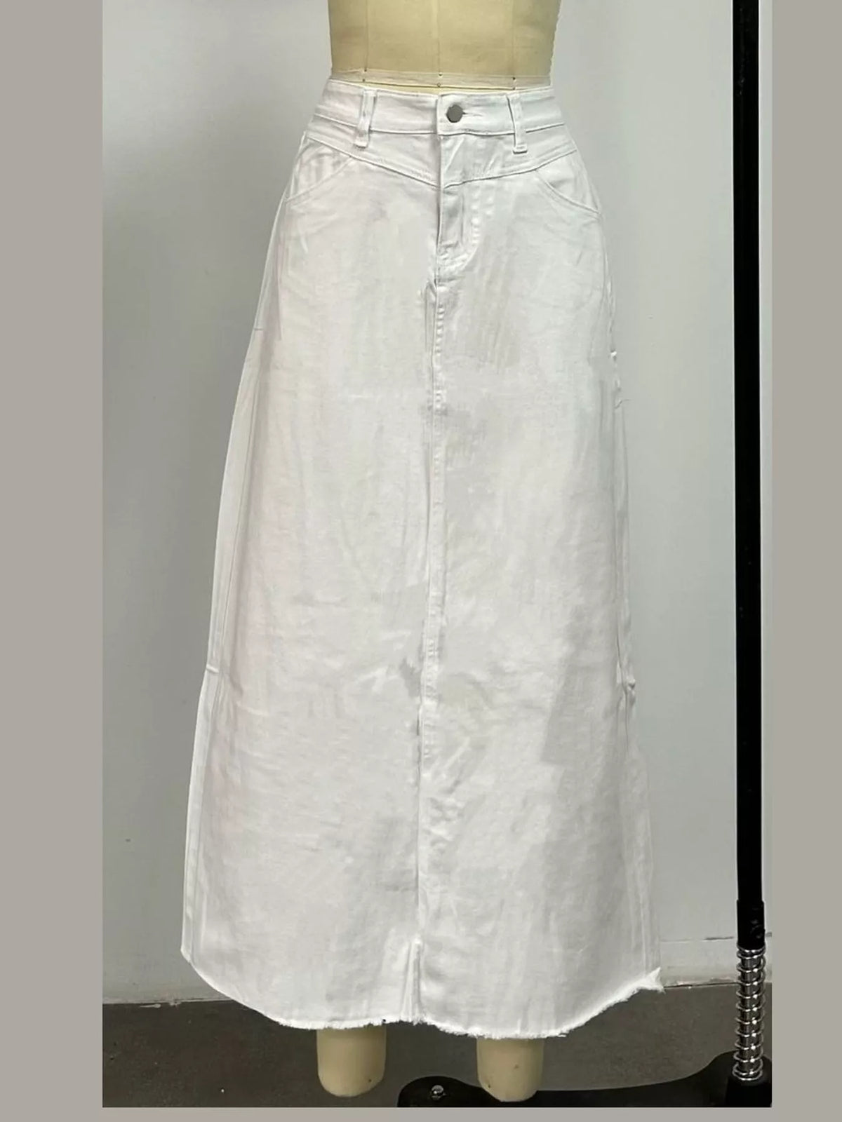 White raw-hem maxi denim skirt with button front and front pockets