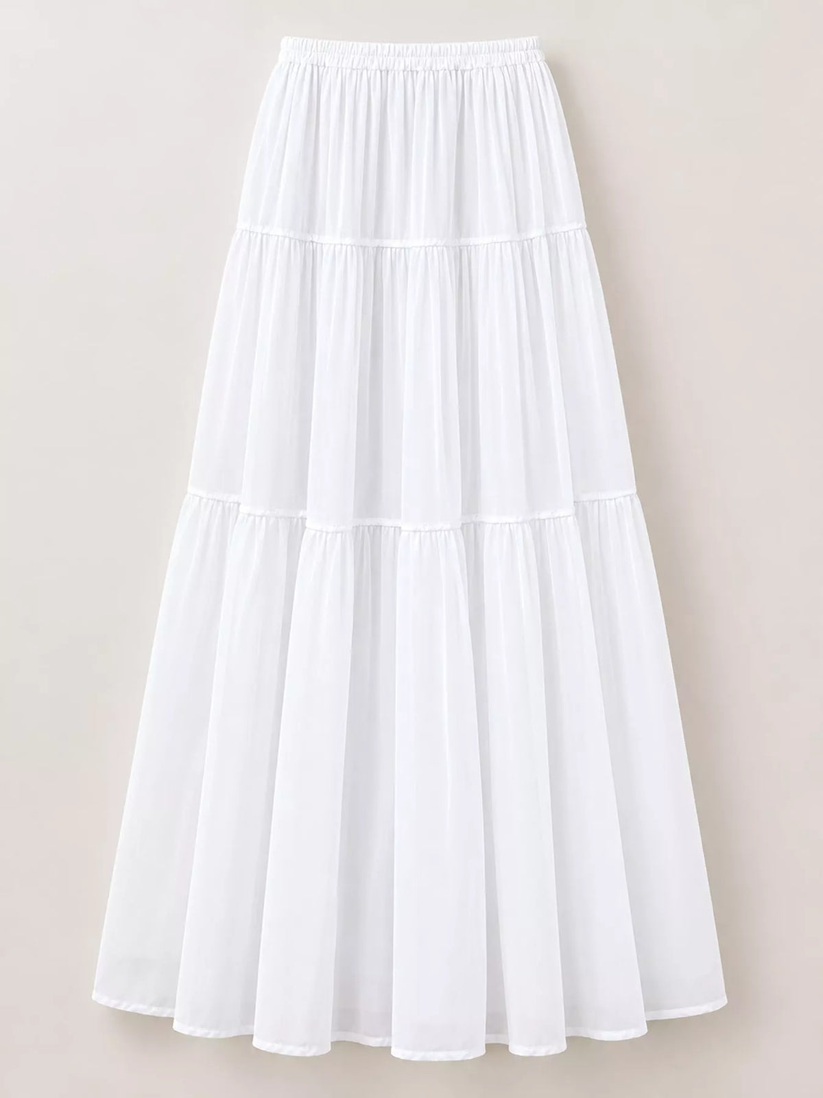 White tiered pleated maxi skirt with elastic waistband and wide tiered skirt panels