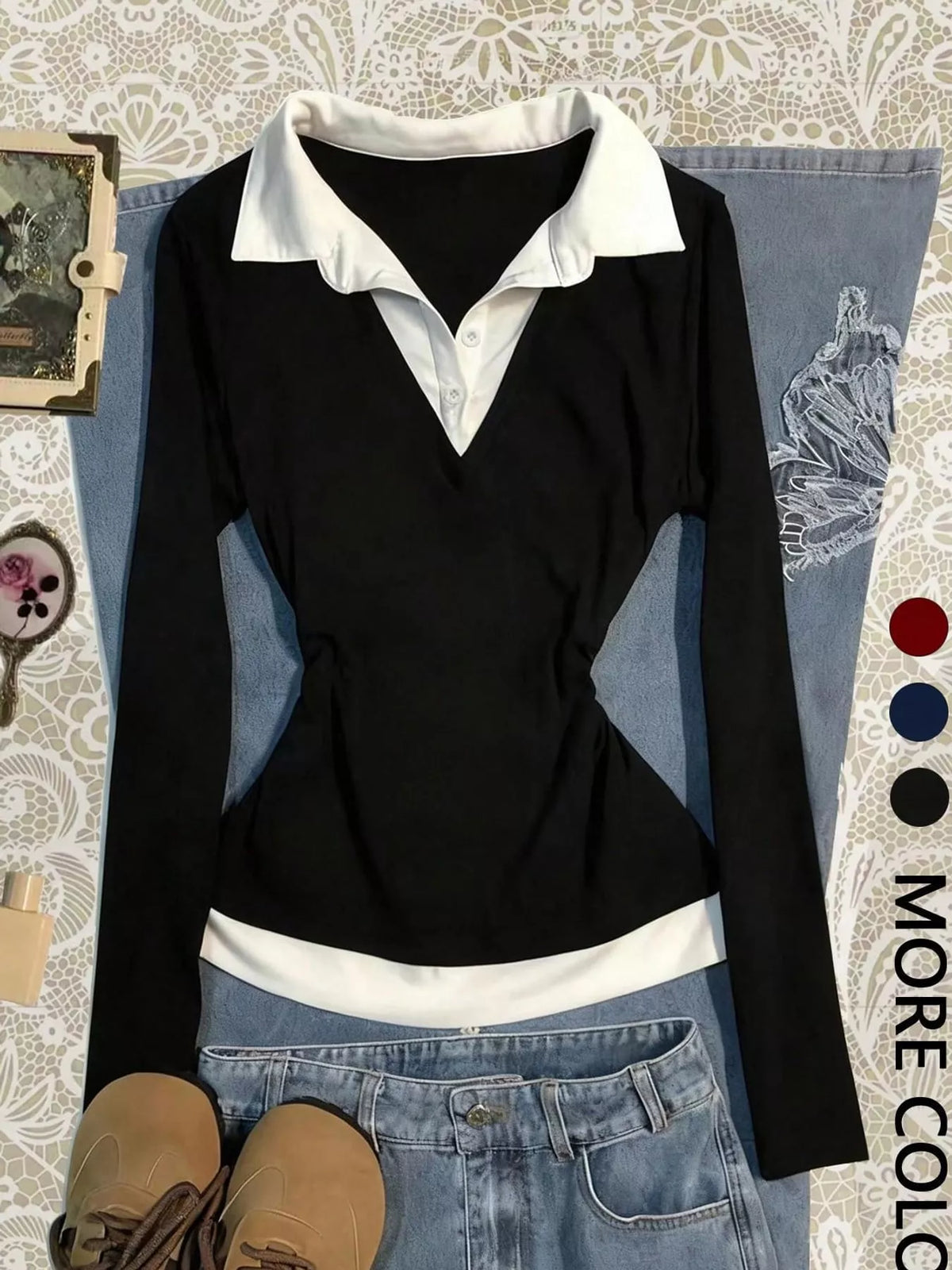 Black long-sleeve shirt with white contrast collar and hem, V-neck, and fitted waist