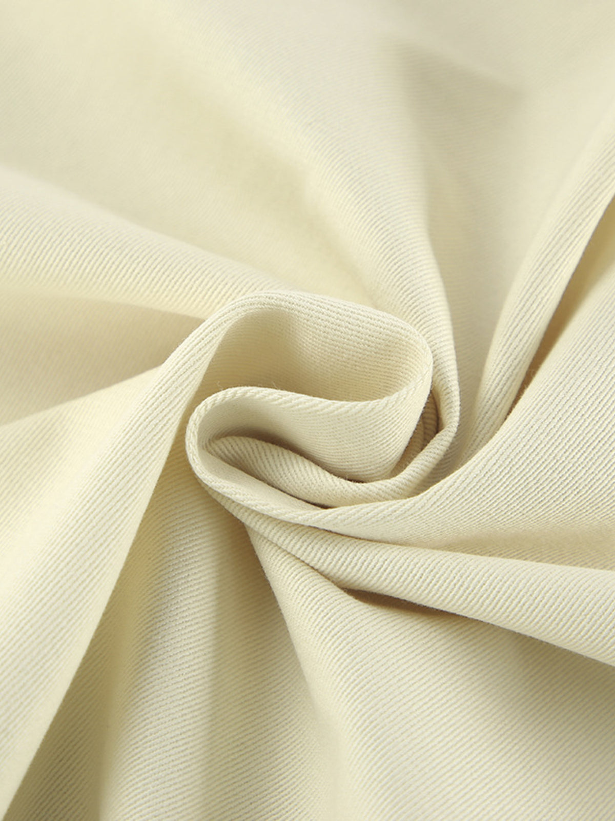 Beige midi skirt fabric close-up showing its smooth, finely woven texture.